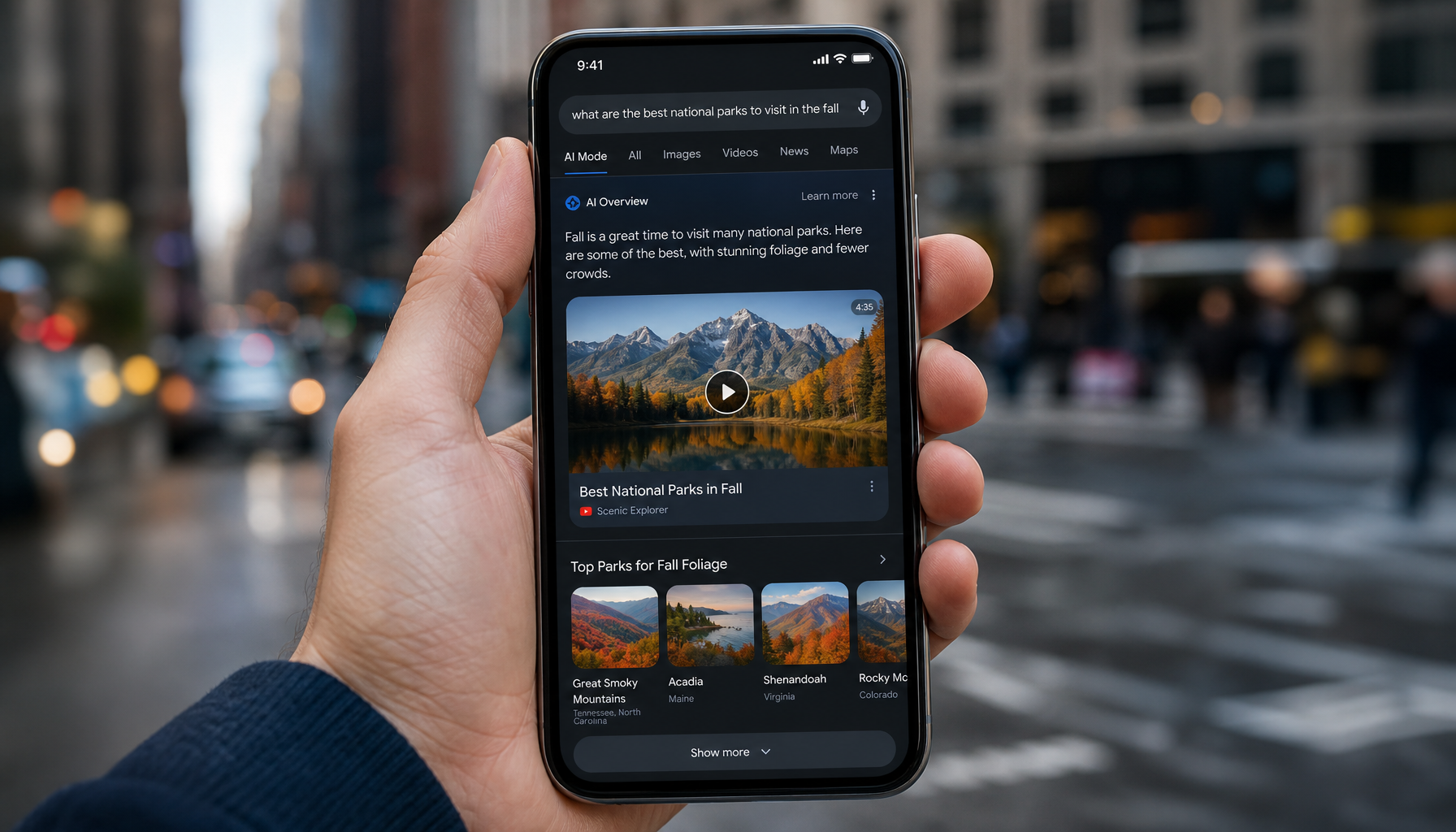 Mobile phone showing AI search results with rich media cards and video previews